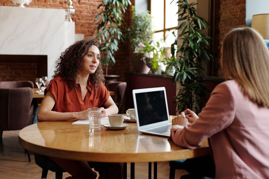 Two professionals in a collaborative business meeting